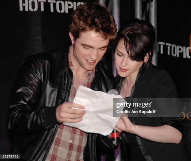 Actor Robert Pattinson and actress Kristen Stewart speak at "The Twilight Saga: New Moon" - Cast Tour at Hot Topic on November 6, 2009 in Hollywood,...