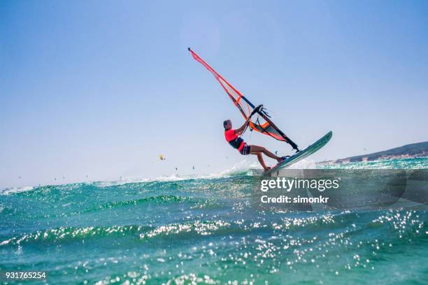 people doing kitesurfing and windsurfing - kiteboarding stock pictures, royalty-free photos & images