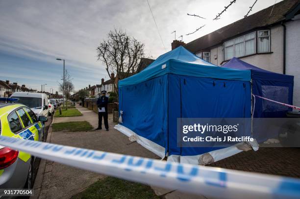 Police forensics tent stands outside the home of Russian exile Nikolai Glushkov who was found dead at his home in New Malden on March 14, 2018 in...