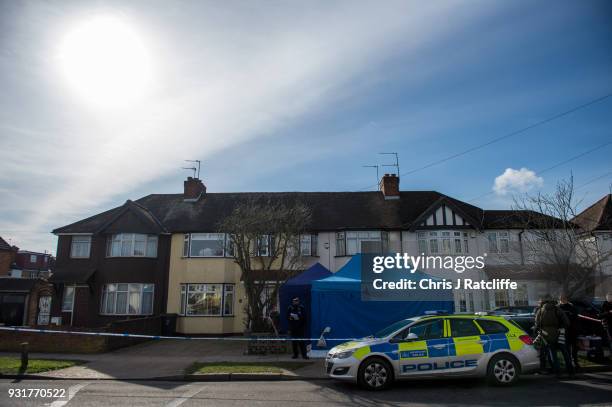 Police forensics tent stands outside the home of Russian exile Nikolai Glushkov who was found dead at his home in New Malden on March 14, 2018 in...