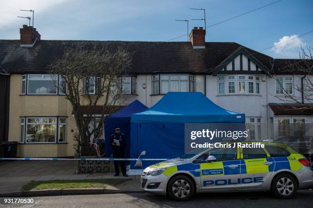 Police forensics tent stands outside the home of Russian exile Nikolai Glushkov who was found dead at his home in New Malden on March 14, 2018 in...