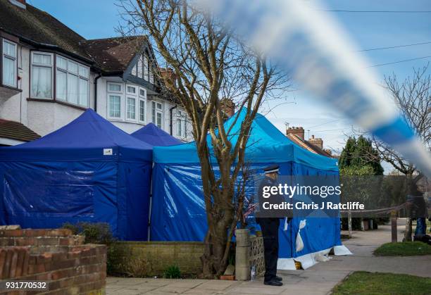 Police forensics tent stands outside the home of Russian exile Nikolai Glushkov who was found dead at his home in New Malden on March 14, 2018 in...