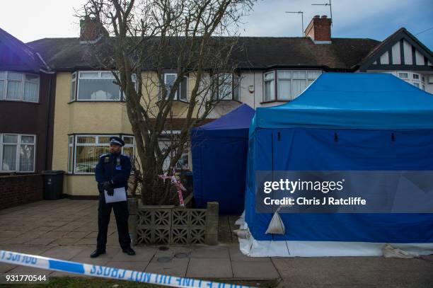 Police forensics tent stands outside the home of Russian exile Nikolai Glushkov who was found dead at his home in New Malden on March 14, 2018 in...