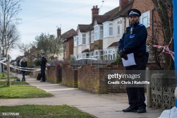 Police forensics tent stands outside the home of Russian exile Nikolai Glushkov who was found dead at his home in New Malden on March 14, 2018 in...