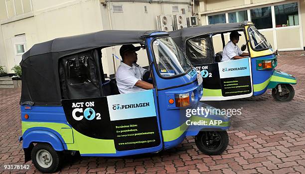 Indonesian "bajaj" three-wheeled mini commutesr that have been converted to run on compressed natural gas make a test run after being unveiled by...