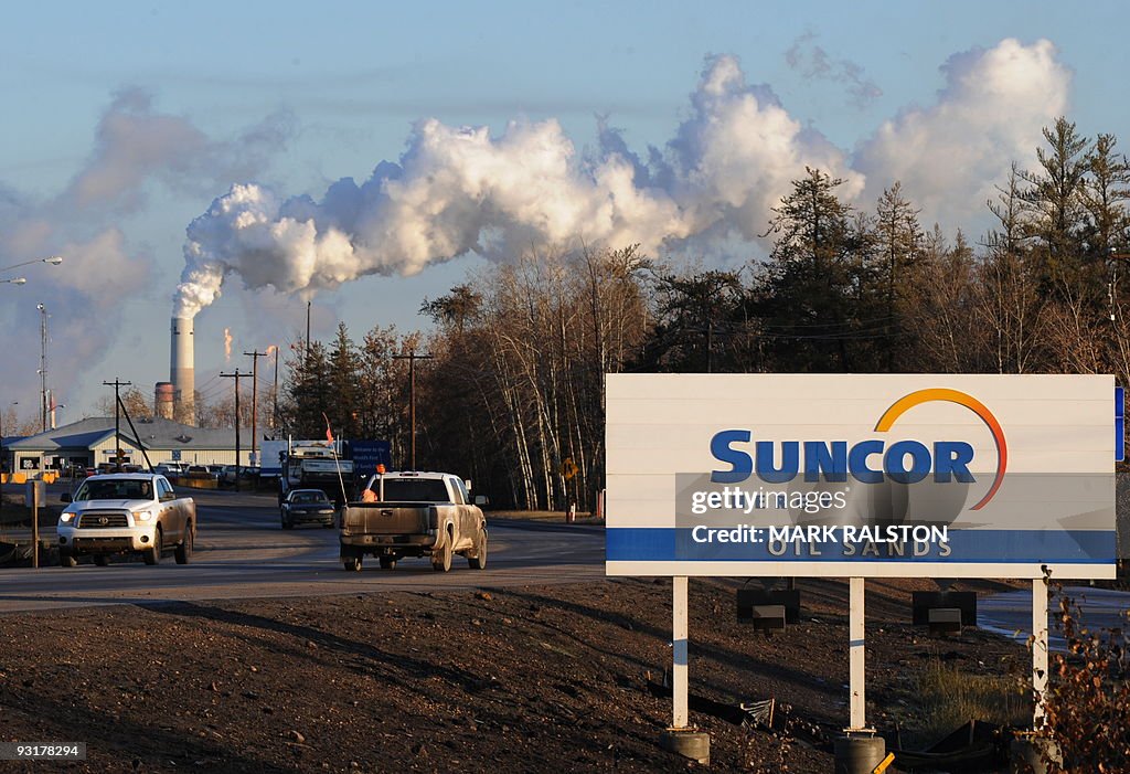 Workers leave the Suncor oil sands extra