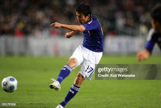 Makoto Hasebe of Japan scores the first goal during AFC Asia Cup 2011 Qatar qualifier match between Hong Kong and Japan at Hong Kong Stadium on...