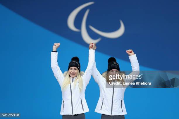 Henrieta Farkasova of Slovakia and her guide Natalia Subrtova celebrate their Gold medal during the medal ceremony for Women's Giant Slalom during...