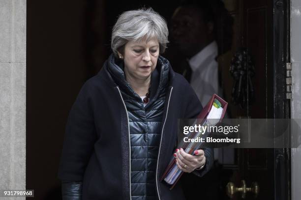 Theresa May, U.K. Prime minister, leaves 10 Downing Street following a meeting in London, U.K., on Wednesday, March 14, 2018. May publicly blamed...