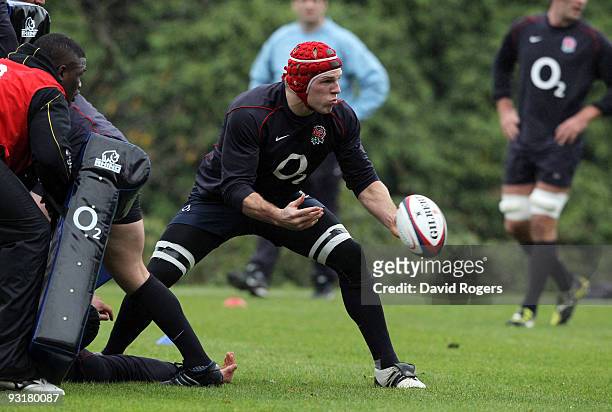 James Haskell passes the ball during the England training session held at Pennyhill Park on November 18, 2009 in Bagshot, England.