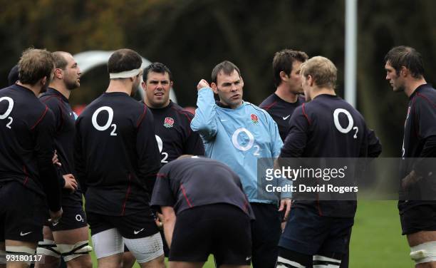 John Wells, the England forwards coach issues instructions during the England training session held at Pennyhill Park on November 18, 2009 in...