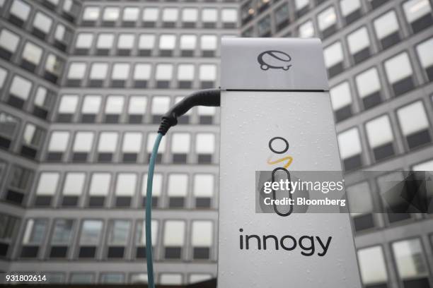 An electric automobile charging station, operated by Innogy SE, stands outside the headquarters of RWE AG in Essen, Germany, on Tuesday, March 13,...