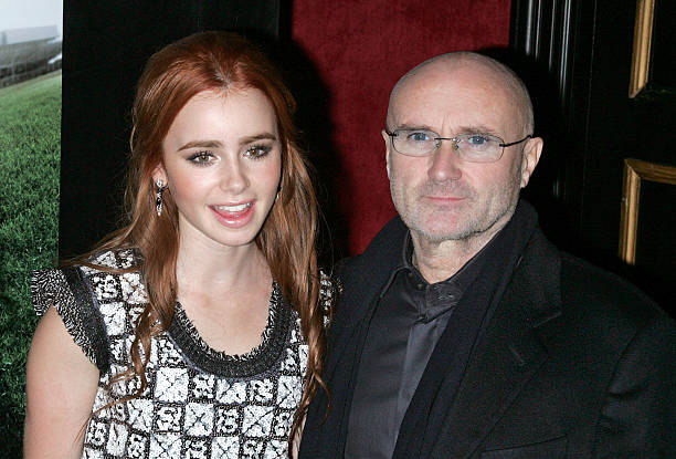 Actress Lily Collins and Musician Phil Collins attend "The Blind Side" premiere at the Ziegfeld Theatre on November 17, 2009 in New York City.