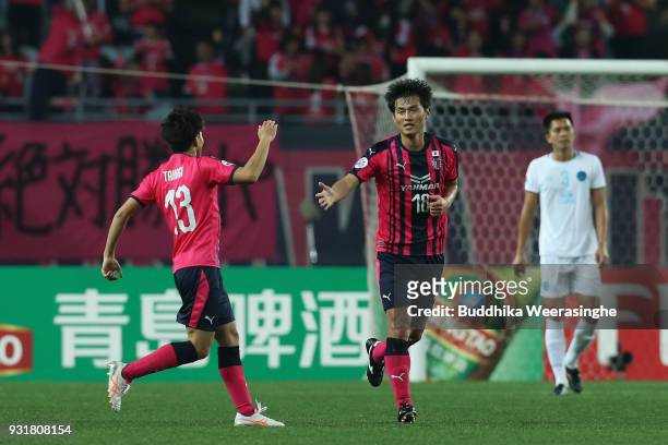 Yang Dong-Hyun of Cerezo Osaka celebrates scoring his side's first goal with his team mate Toshiyuki Takagi during the AFC Champions League Group G...