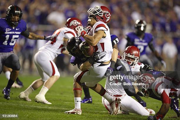 Utah David Reed in action during tackle by TCU Brian Alexis . Fort Worth, TX CREDIT: Bob Rosato