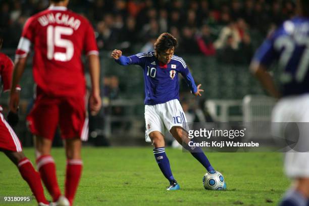 Shunsuke Nakamura of Japan scores the third goal during AFC Asia Cup 2011 Qatar qualifier match between Hong Kong and Japan at Hong Kong Stadium on...