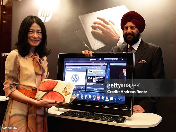 Designer Vivienne Tam and Satjiv Chahil, senior vice president of personal systems world-wide marketing for HP, attend the IHT Techno Luxury...
