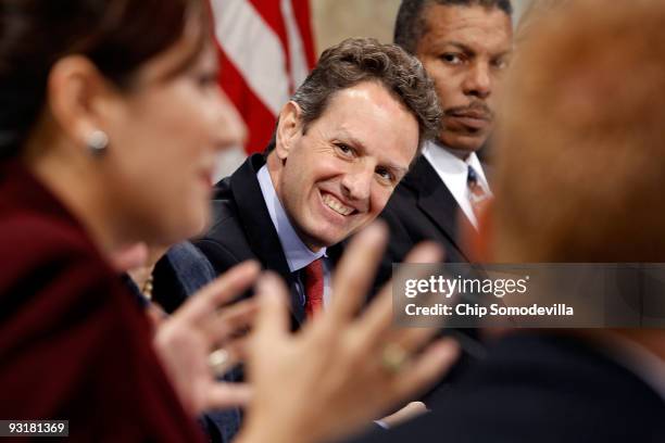 Treasury Secretary Timothy Geithner listens to Landmark Technology President and CEO Lani Hay deliver remarks during a small business forum at the...