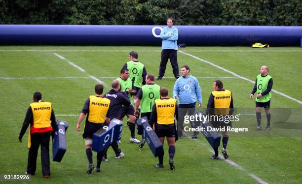 Martin Johnson the England head coach watches his team during an England training session at Pennyhill Park on November 18, 2009 in Bagshot, England.