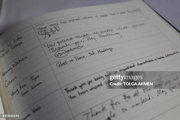 Messages are seen in a condolence book at Gonville and Caius College, where British physicist, Stephen Hawking was a fellow for over 50 years, at...