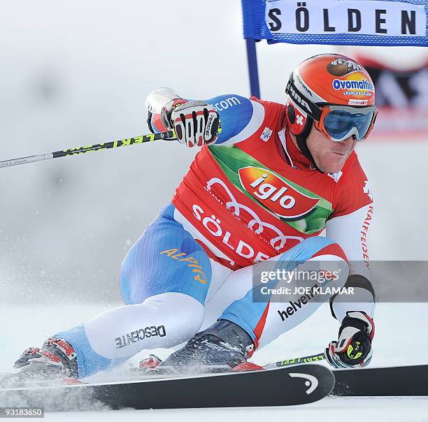 Switzerland's Didier Cuche competes in men's giant slalom during the FIS Alpine Skiing World cup on Rettenbach glacier in Soelden on October 25,...