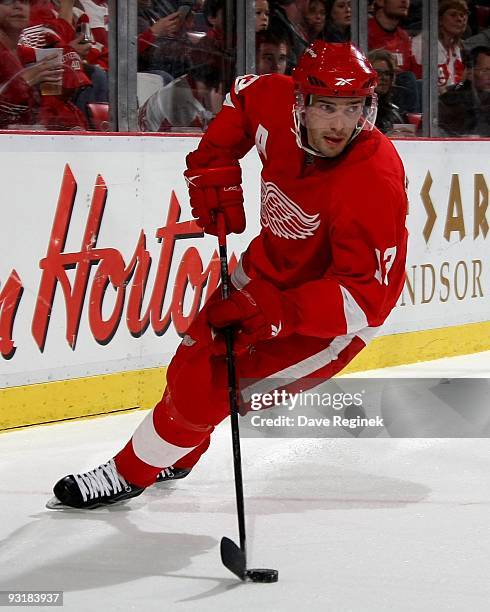 Pavel Datsyuk of the Detroit Red Wings skates around the net with the puck during a NHL game against the Anaheim Ducks at Joe Louis Arena on November...