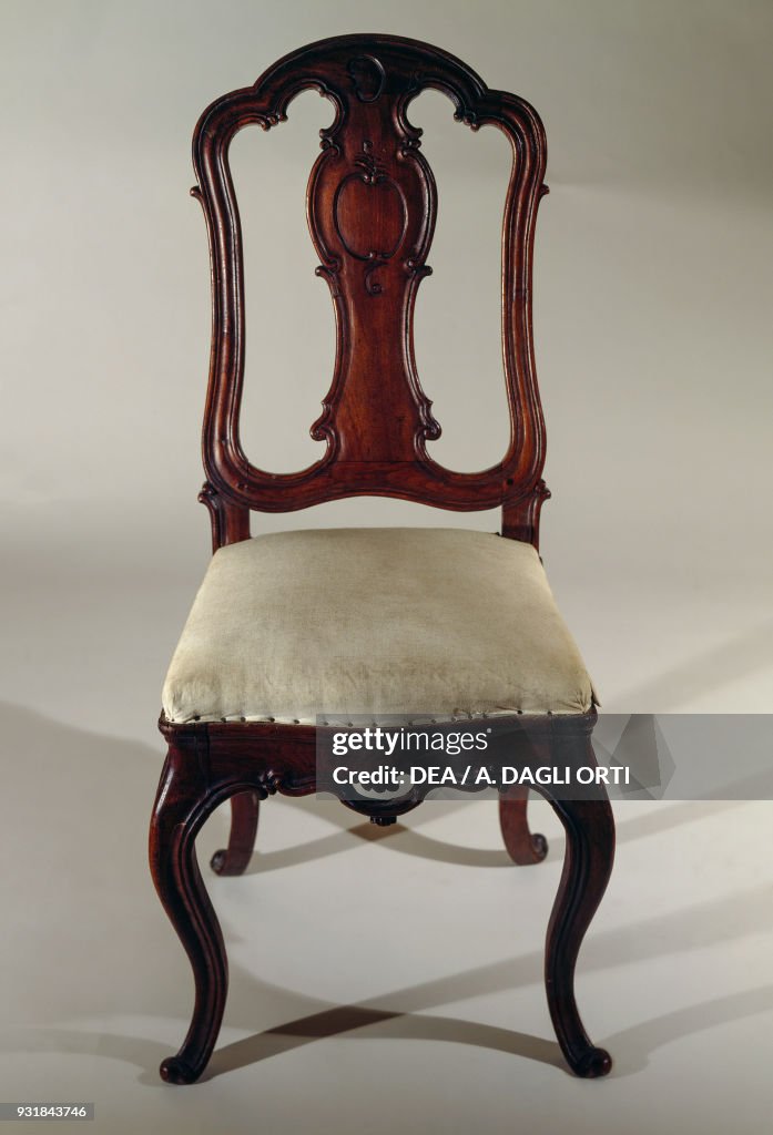Rococo-style carved chair with upholstered seat