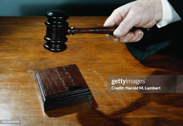 Close-up of judge holding gavel