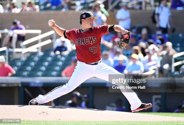 Kris Medlen of the Arizona Diamondbacks delivers a pitch during a spring training game against the Colorado Rockies at Salt River Fields at Talking...