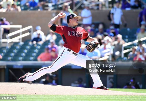 Kris Medlen of the Arizona Diamondbacks delivers a pitch during a spring training game against the Colorado Rockies at Salt River Fields at Talking...