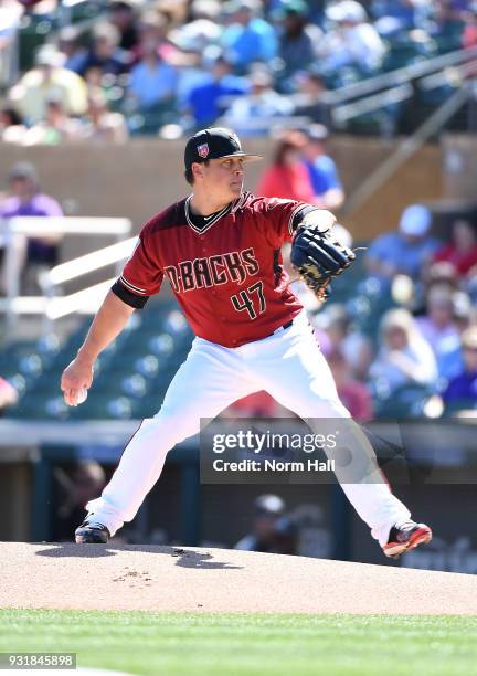 Kris Medlen of the Arizona Diamondbacks delivers a pitch during a spring training game against the Colorado Rockies at Salt River Fields at Talking...