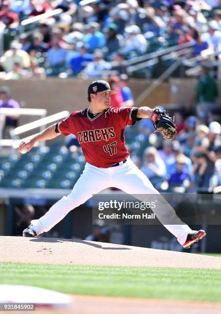 Kris Medlen of the Arizona Diamondbacks delivers a pitch during a spring training game against the Colorado Rockies at Salt River Fields at Talking...