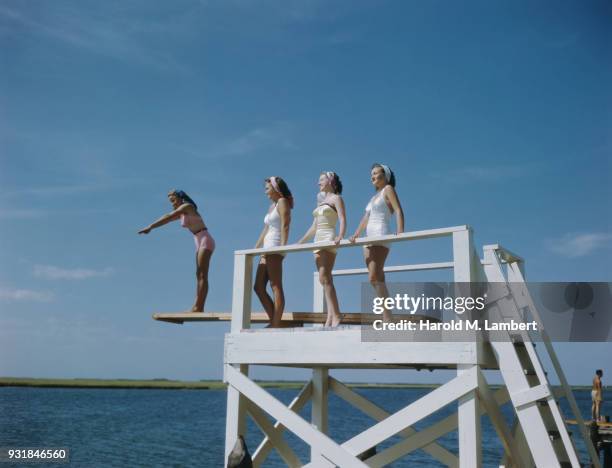 Beautiful women diving into sea