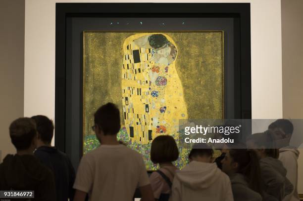 Visitors are seen as they admire oil painting KISS at the World's largest collection of Gustav Klimt at the Upper Belvedere, Belvedere Palace in...