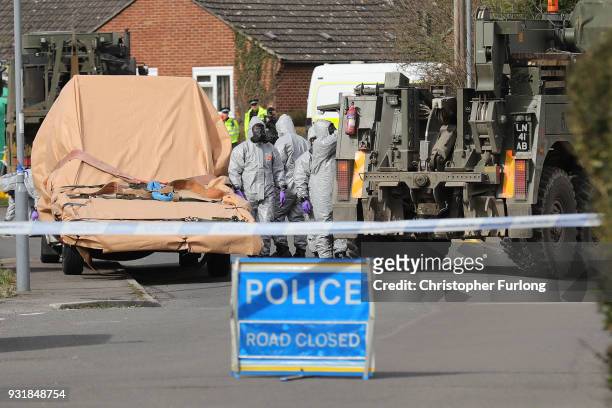 Forensic teams work at an address in Gillingham, Dorset as they remove a recovery truck used following the Salisbury nerve agent attack, on March 14,...