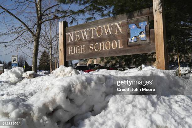 Snow covers the entrance of Newtown High School on March 14, 2018 in Sandy Hook, Connecticut. Students at the school, near the site of the Sandy Hook...