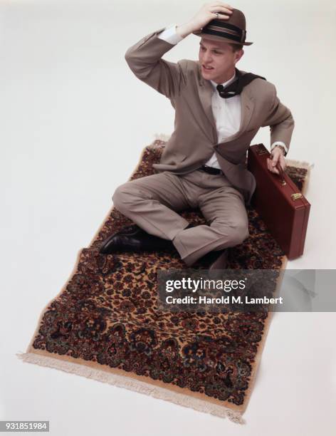 Front view of man sitting on magic carpet
