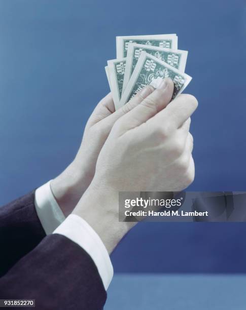 Human hand holding paper money