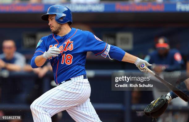 Travis d'Arnaud of the New York Mets in action during a spring training game against the Houston Astros at First Data Field on March 6, 2018 in Port...