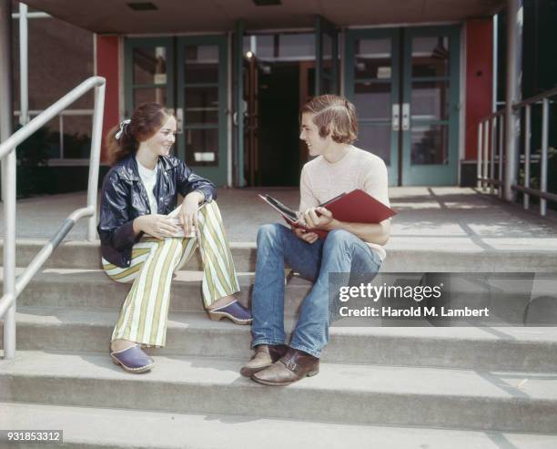 Young couple sitting on steps