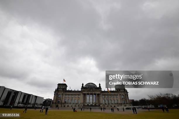 The Reichstag housing the Bundestag is pictured on March 14, 2018 in Berlin, as the new German government was sworn in here. German Chancellor Angela...