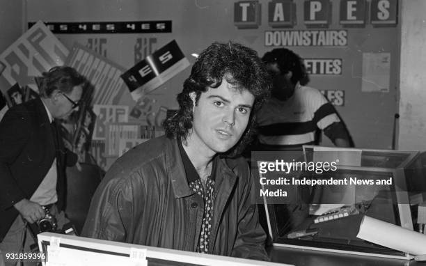 Donny Osmond signing autographs at the Virgin Mega-Store in Tallaght, Dublin, circa October 1987 .
