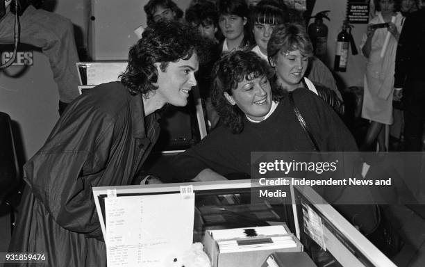 Donny Osmond signing autographs at the Virgin Mega-Store in Tallaght, Dublin, circa October 1987 .