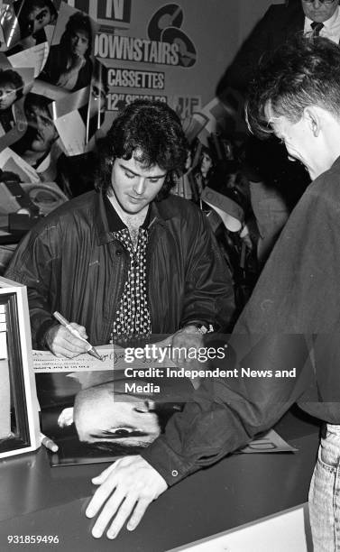 Donny Osmond signing autographs at the Virgin Mega-Store in Tallaght, Dublin, circa October 1987 .