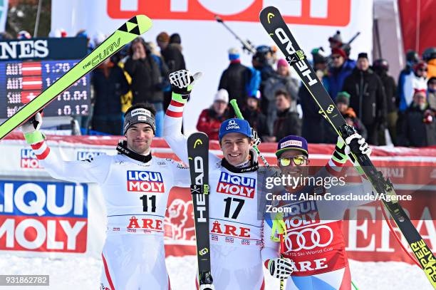 Vincent Kriechmayr of Austria takes 1st place, Matthias Mayer of Austria takes 1st place, Beat Feuz of Switzerland takes 2nd place during the Audi...