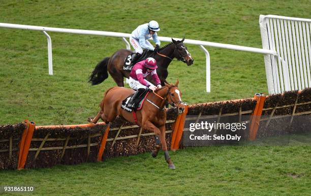 Cheltenham , United Kingdom - 14 March 2018; Samcro, with Jack Kennedy up, clears the last ahead of Black Op, with Noel Fehily up, who finshed...