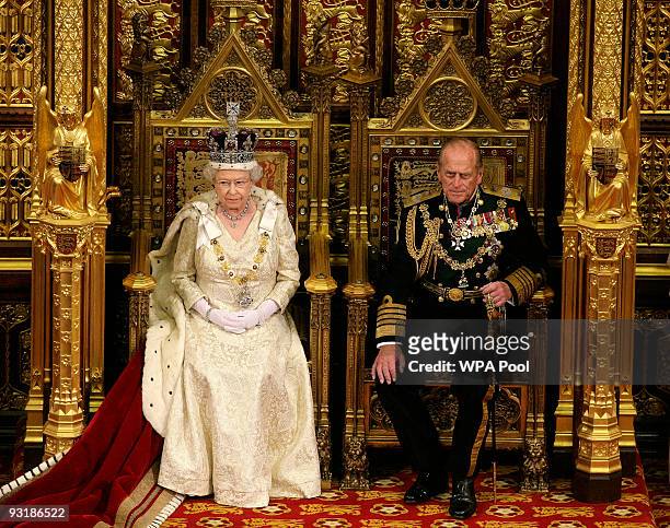 Queen Elizabeth II, accompanied by Prince Philip, Duke of Edinburgh gives her speech in the Lords chamber during the annual State opening of...