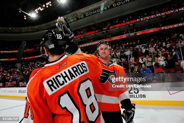 Mike Richards and Jeff Carter of the Philadelphia Flyers celebrate their 3-2 victory against the New Jersey Devils on November 16, 2009 at the...