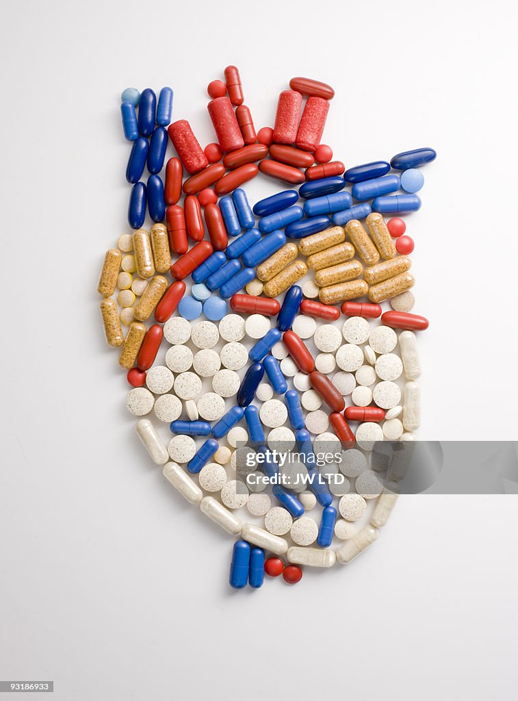 Capsules and pills in shape of human heart