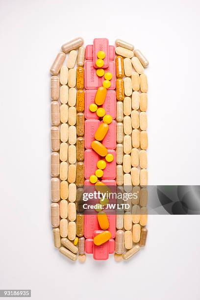 capsules and pills in shape of hot dog - craving food stock pictures, royalty-free photos & images